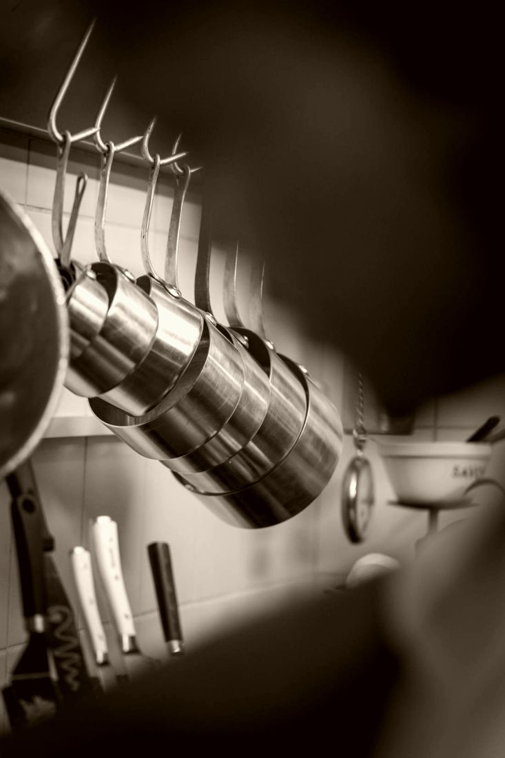 Copper pots on the pass in the studio kitchen