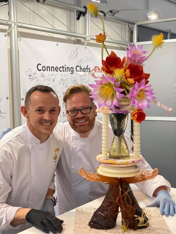 Nicolaas, right, beside a finished sugar showpiece at a Connecting Chefs event