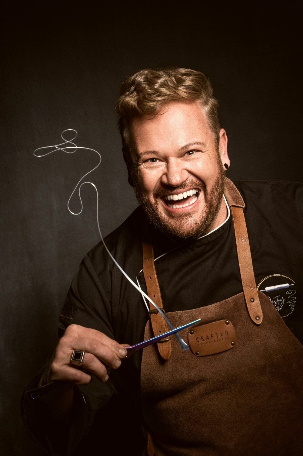 Nicolaas, mid laugh, tools still in hand