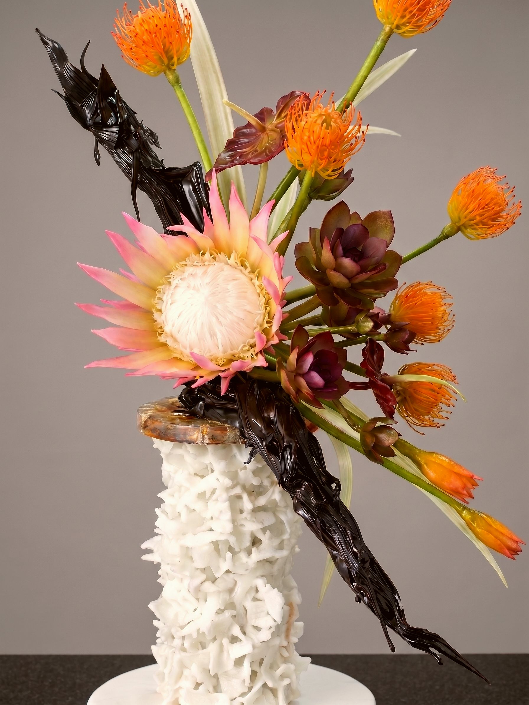 A king protea and succulents made entirely from sugar